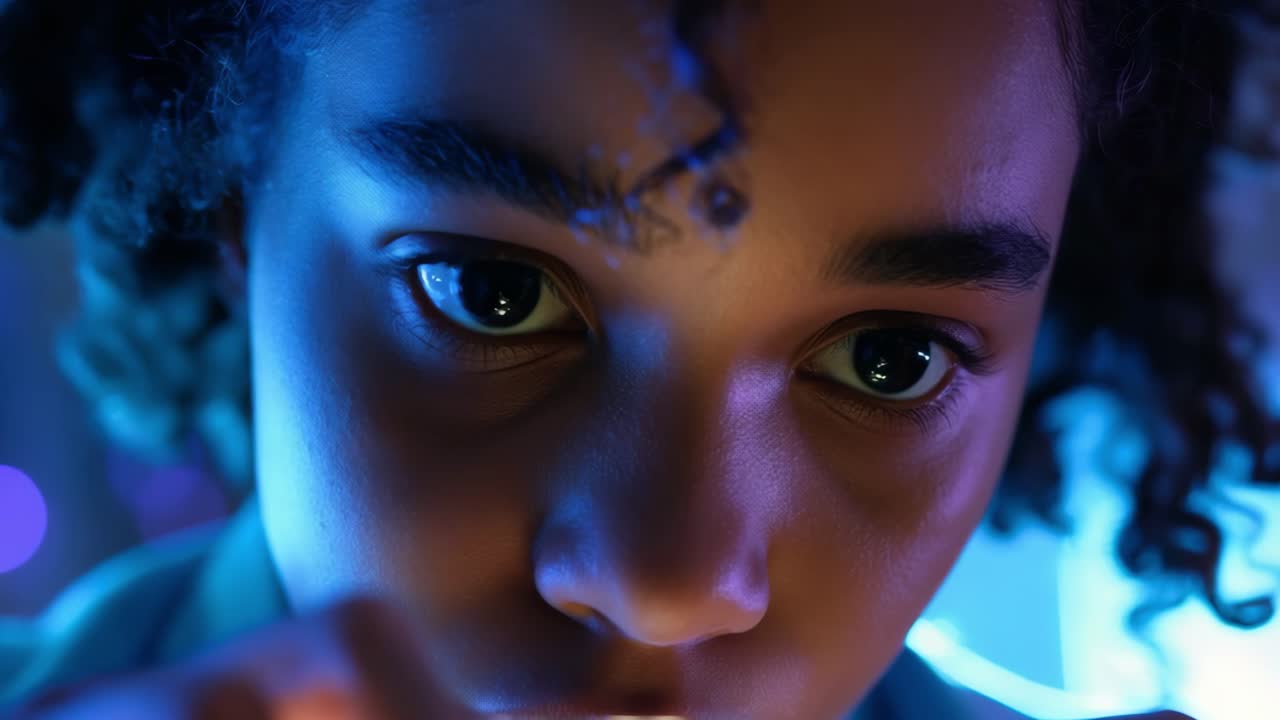 Closeup of child in neon lighting