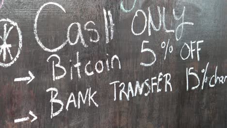 full shot, a wooden board with a written sign of bitcoin cash only and discount in the bitcoin beach in el salvador mexico