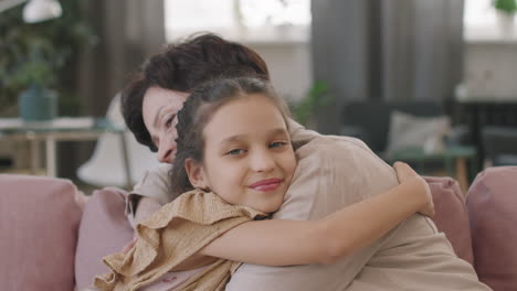 grandmother and granddaughter hugging