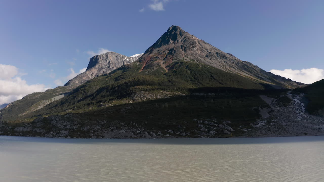 A drone shot of a mountain on glacier lake in British Columbia