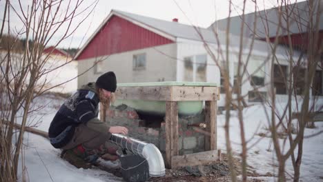 a man is installing a vent for the diy hot tub - static shot