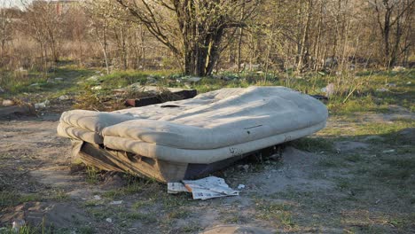 brown old dilapidated couch, set in the middle of nowhere