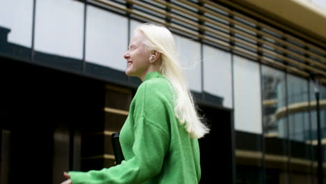 happy woman holding coffee cup outdoors