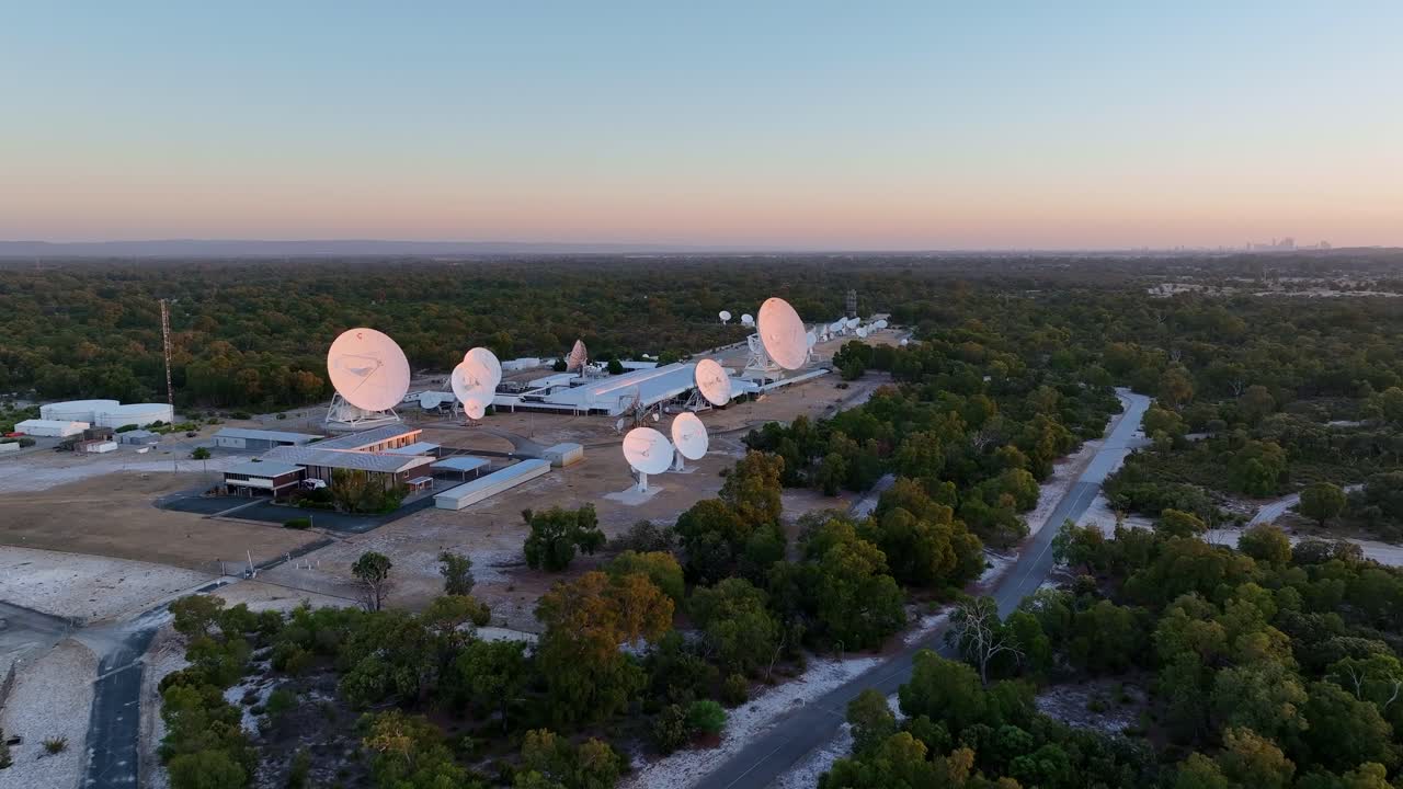 Telecommunications Facility With Satellite Dishes, Transmit Information By Radio Waves. - aerial shot