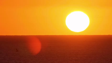 wide view of beautiful dramatic sunset over sea or ocean with dramatic sky