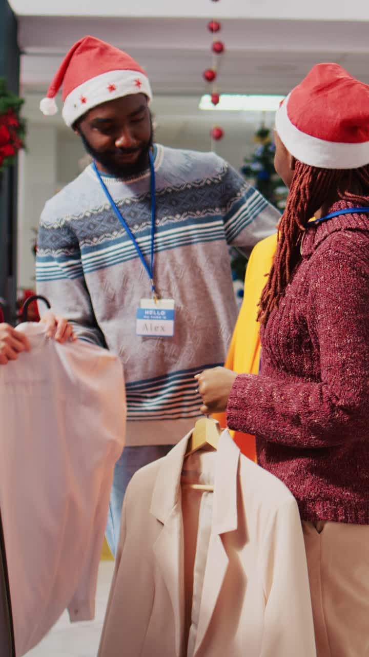 Vertical video Colleagues showing client garments