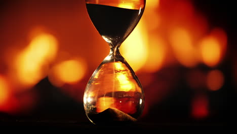 hourglass clock against the background of the fireplace 2