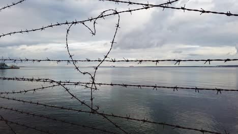 a heart shape symbol made out of barbed wire on the prison fence in tallinn, estonia