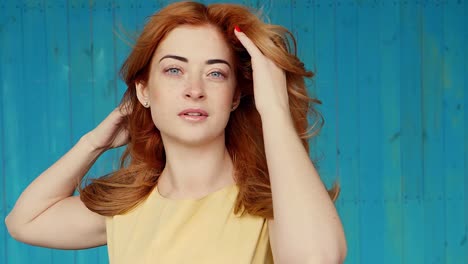 woman with red hair in a yellow dress