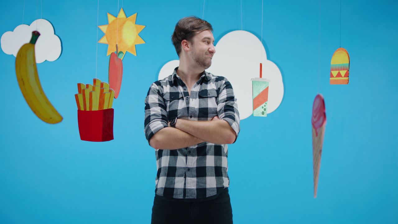 Man looking displeased surrounded by food items