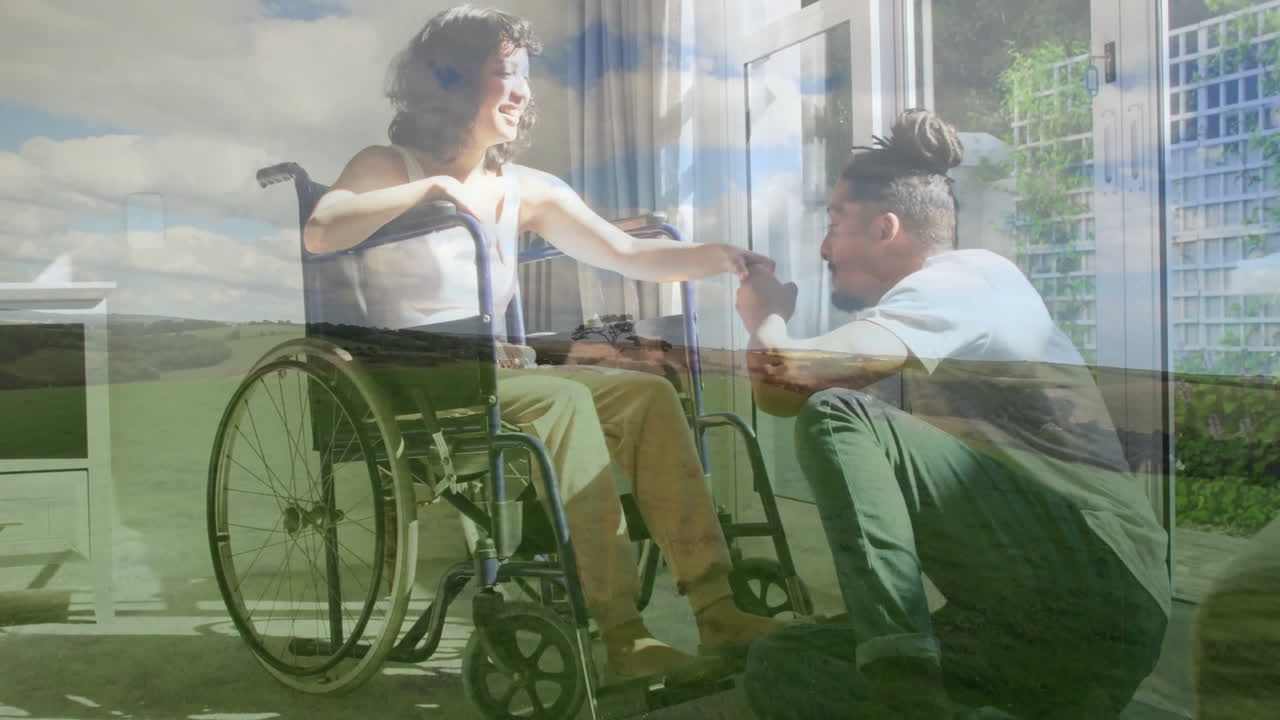 Holding hands, person in wheelchair smiling with kneeling individual in animation