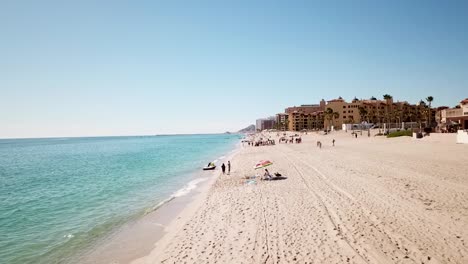 Aerial-shot-of-a-resort's-private-beach-off-Mexico's-beautiful-coast