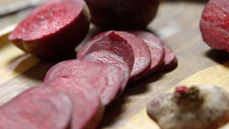 sliced beetroot arranged on wooden tray 4k