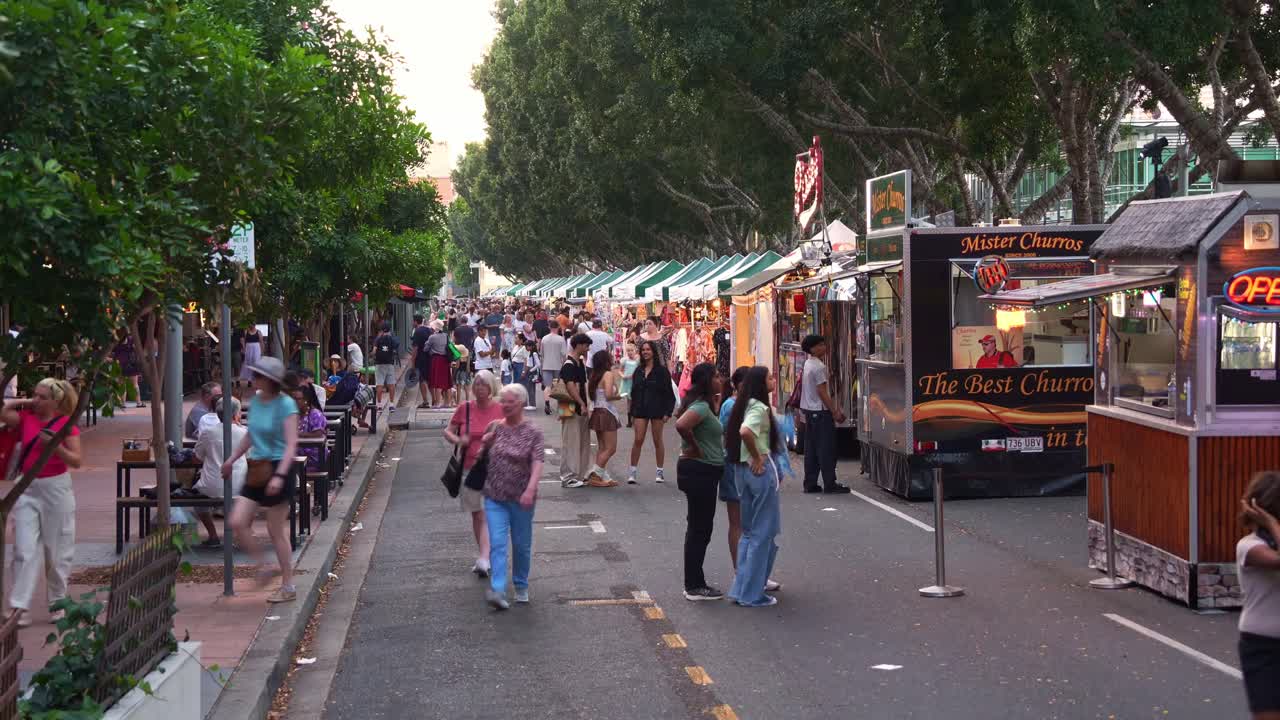 Weekend Collective Markets in South Brisbane, Brisbane's premier recreational and cultural destination with market stalls run along Little Stanley street, time-lapse shot of the lively environment.