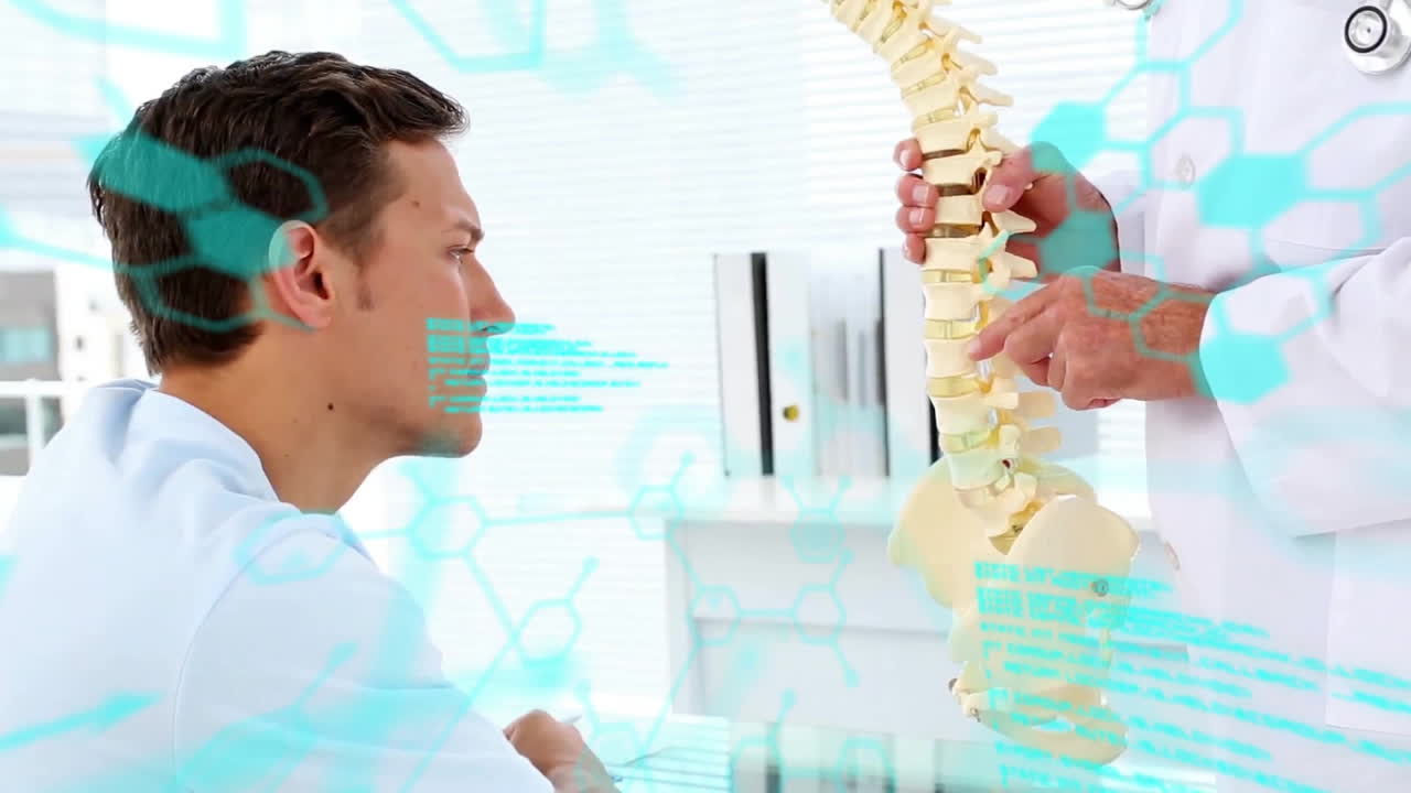 Doctor explaining spine model to patient, medical data animation over consultation