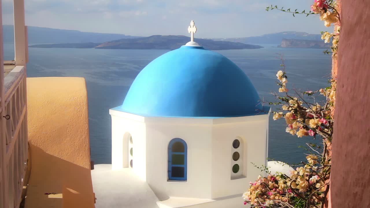 Serene Blue Dome Church overlooking the Aegean Sea in Santorini, Greece