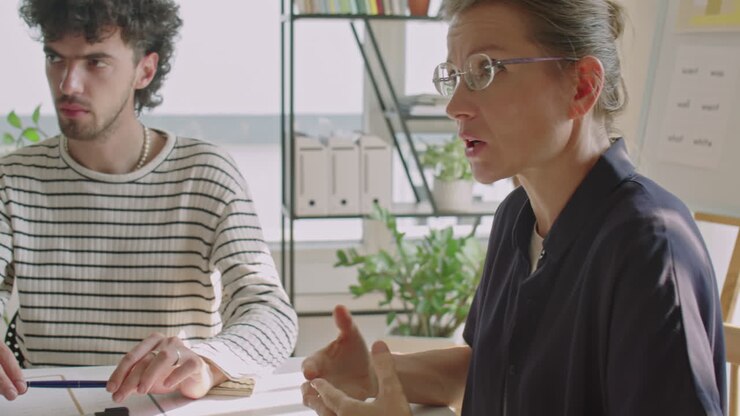 Female Teacher Answering Questions during Lesson