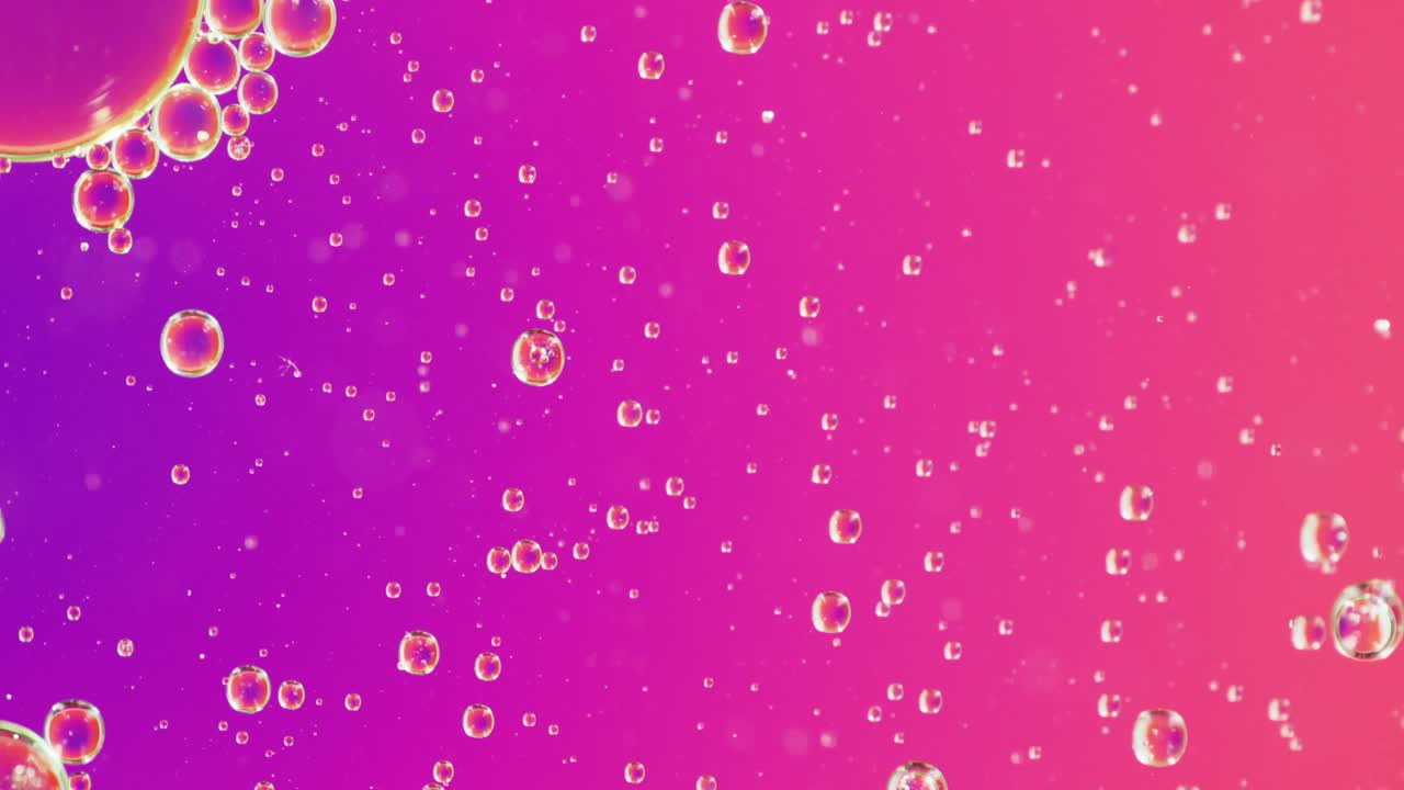 Animation of bubbles moving on purple background with copy space
