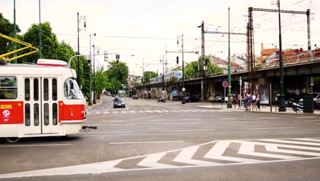 city street scene with tram and train