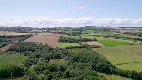 Aerial-sideways-view-over-Brittany-rural-landscape-in-France