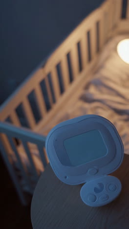 baby monitor by a crib at night