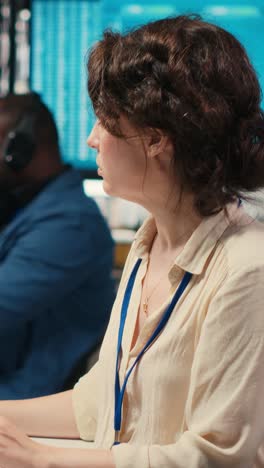 vertical video female advisor in workstation thinking about a new strategy to increase profit