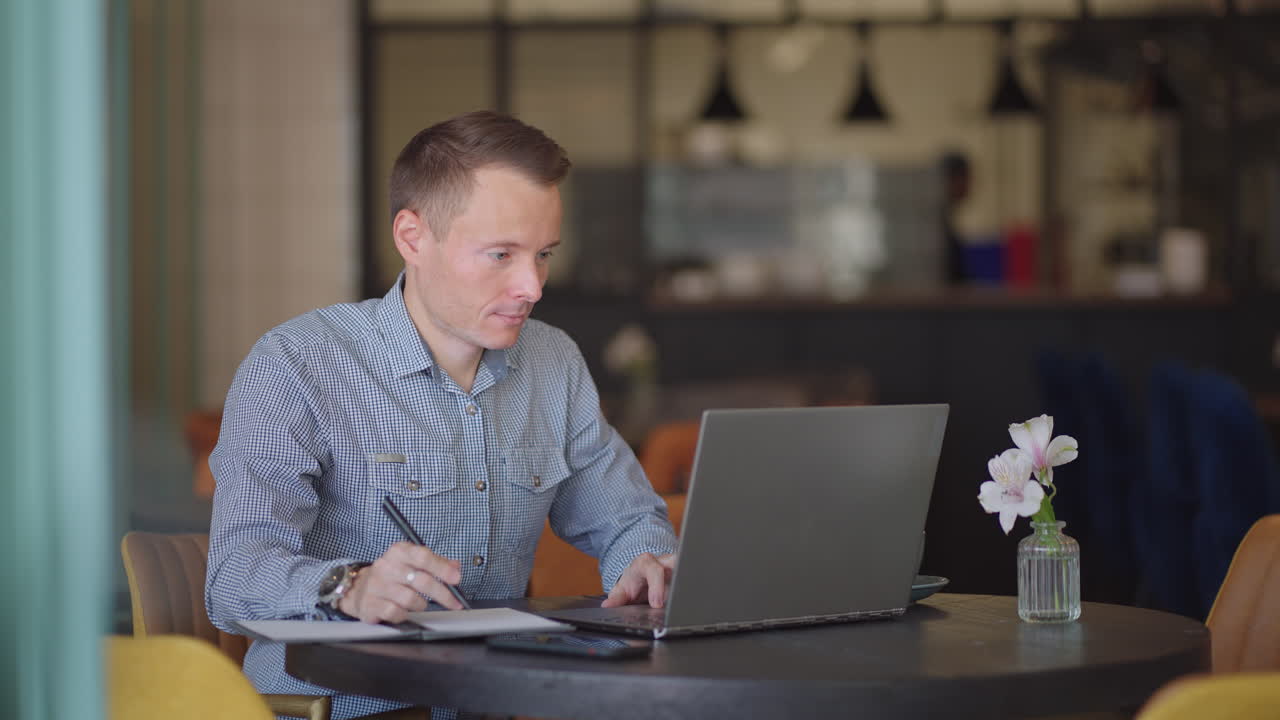Hispanic latin man college student using laptop computer watching distance online learning seminar class remote university webinar or having virtual classroom meeting in university creative space.