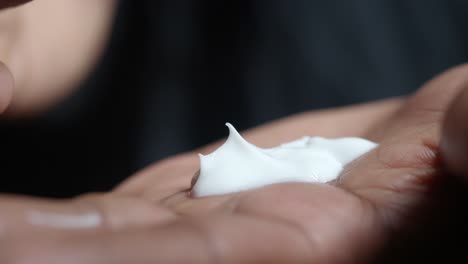 applying lotion on hand