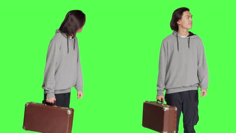 young person carries vintage briefcase