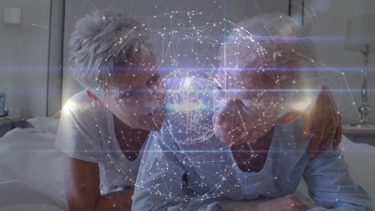 Animace tvarů pohybujících se nad starším bělošským párem, který si povídá.