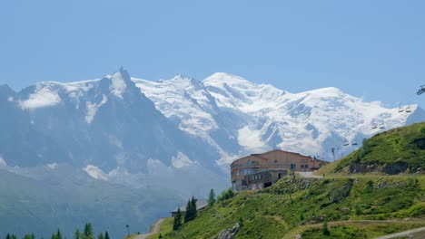 the station of flagere and behind the view of mont blanc in a sunny day, in the valley of chamonix, in france