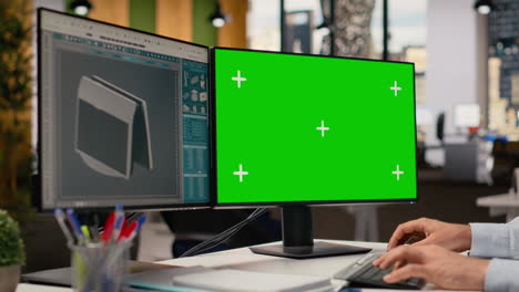 closeup of technician using green screen pc to create solar powered device