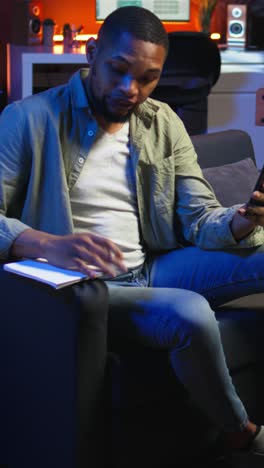 vertical video african american teleworker calling coworker on video conference to take notes