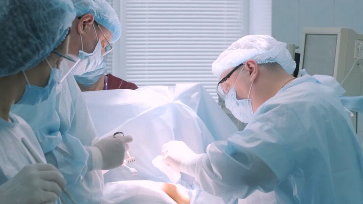 A surgeon in a sterile operating room performing a surgical procedure with focus and precision. Represents healthcare, surgery, medical expertise, and patient care