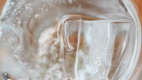 close-up of ice cubes in a glass of water