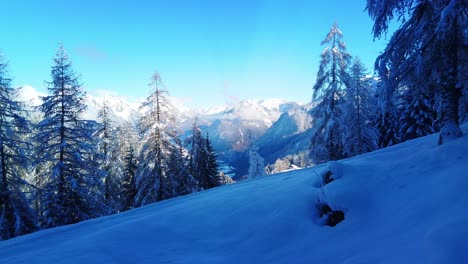 Scenic-mountain-alps-of-Austria-during-winter-time-with-pine-trees-and-a-blue-sky-