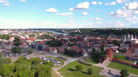 Aerial-View-of-Kaunas-Lithuania-Old-Town-Buildings,-Church,-Castle-and-Park-on-Summer-Season,-Drone-Shot-60fps