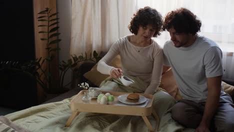 couple's easter breakfast in bed