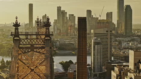 NYC-New-York-Aerial-v384-zoomed-flyover-landmark-Queensboro-bridge-over-East-river-capturing-cityscape-of-Long-Island-City-at-Queens-borough-at-sunrise---Shot-with-Mavic-3-Pro-Cine---September-2023