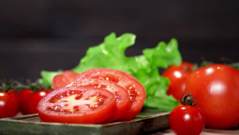 sliced fresh tomato on the cutting board rotates slowly.