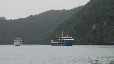 luxury cruise ship floating near the islands in ha long bay, vietnam