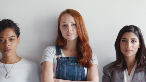 Portrait-Of-Young-Female-Business-Team-Standing-Against-Wall-In-Modern-Office