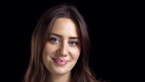 Close-Up-Of-Attractive-Young-Woman-Smiling-Into-Camera