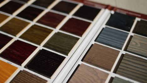 palette with painted wood samples to select the color of wood products. dolly shot