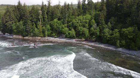 drone orbiting around sombrio beach on vancouver island's wild west coast