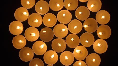 many tea light candles in a circle