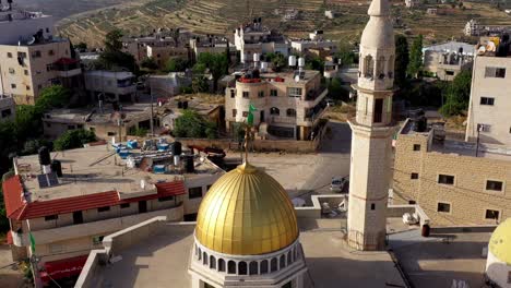 hamas flag waving over golden mosque, palestinian authority, aerial view