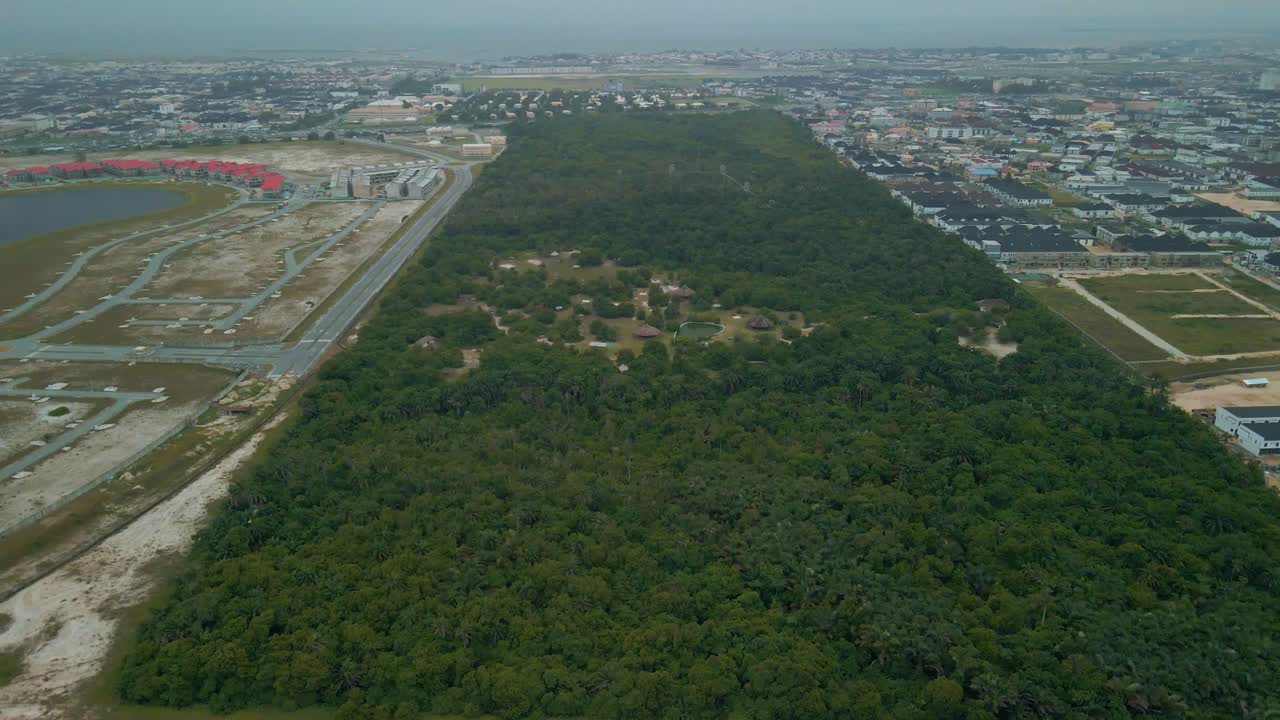 Aerial View of a Lush Green Forest Surrounded by Urban Development in Lagos, Nigeria