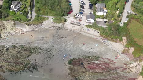 Aerial-orbit-shot-of-Talland-Bay,-on-the-South-West-Coastal-path-between-the-Cornish-Town-of-Looe,-and-village-of-Polperro