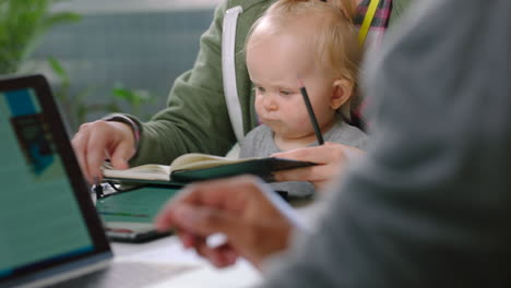 mother with baby, businesswoman with notebook